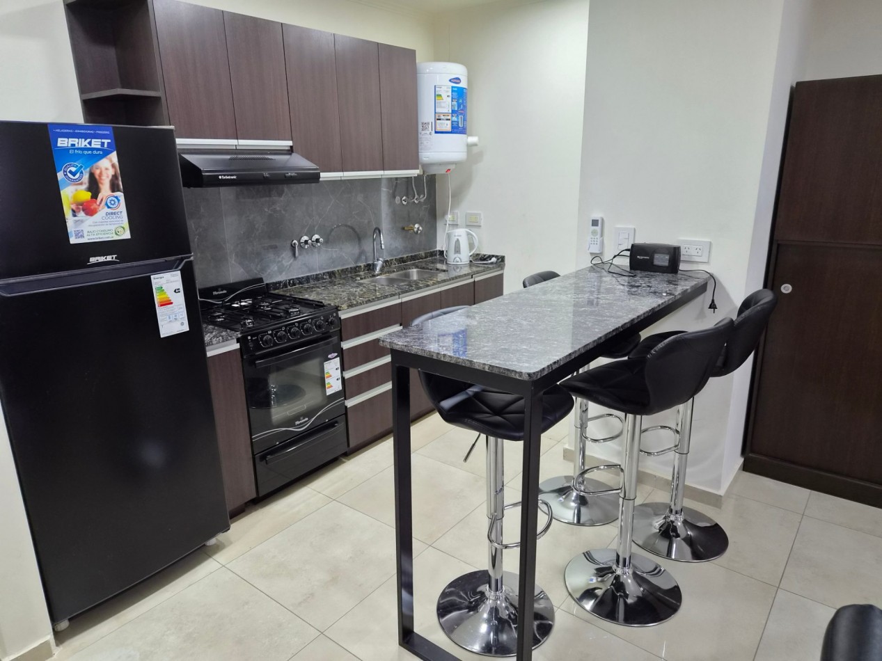 VENTA DPTO 1 DORMITORIO Y COCHERA CENTRO CARLOS PAZ TOTALMENTE AMOBLADO