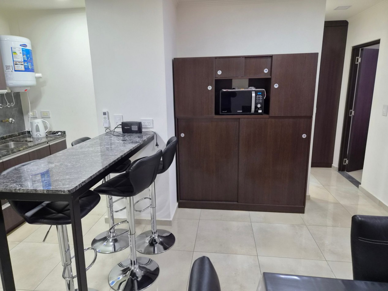 VENTA DPTO 1 DORMITORIO Y COCHERA CENTRO CARLOS PAZ TOTALMENTE AMOBLADO